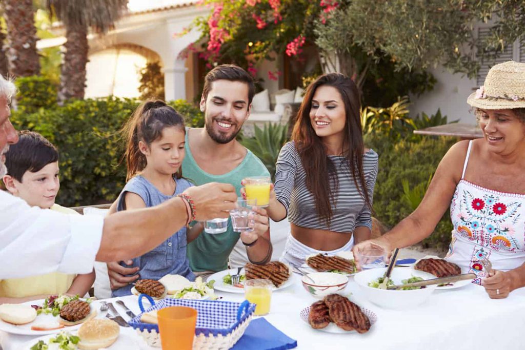 Family enjoys barbecue after having grill cleaned and serviced